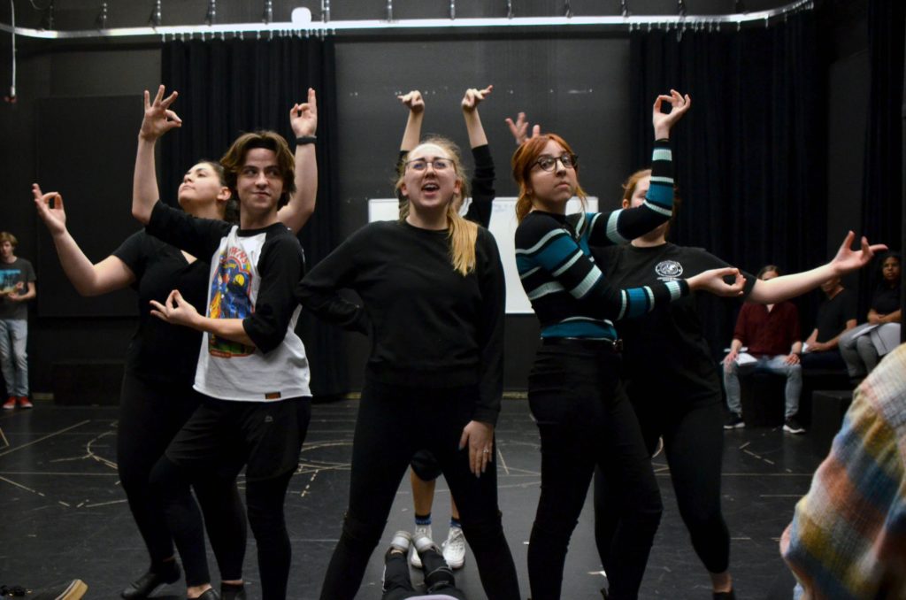 Savannah McCarter and the cast of Pippin rehearse a dance number.