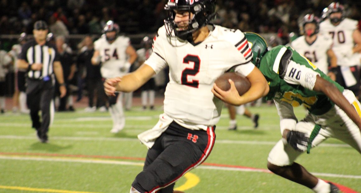 Hart Hawks Qb Jacob Pisano in red and black runs for his 3rd touchdown of the game vs the Canyons Cowboys.