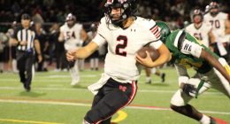 Hart Hawks Qb Jacob Pisano in red and black runs for his 3rd touchdown of the game vs the Canyons Cowboys.