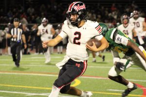 Hart Hawks Qb Jacob Pisano in red and black runs for his 3rd touchdown of the game vs the Canyons Cowboys.