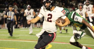 Hart Hawks Qb Jacob Pisano in red and black runs for his 3rd touchdown of the game vs the Canyons Cowboys.