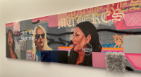 A colorful mural featuring portraits of three women against a backdrop of graffiti-style art and text. The piece includes bold pink, gray, and blue tones with textured fabric squares attached to the surface. One woman wears large hoop earrings that read “Lady Lowrider,” and the background includes stylized lettering and the phrase “her ride.”
