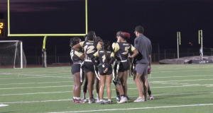 Golden Valley Girls Flag Football team Huddles up before a play.