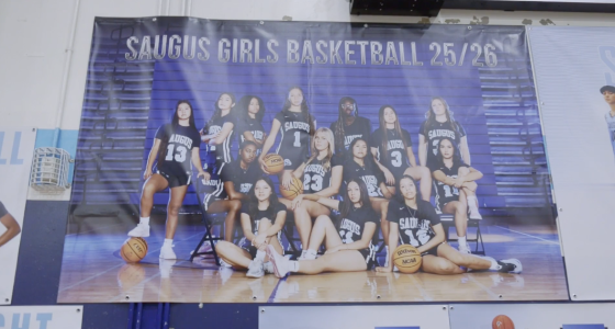 The banner features a team photo of the Saugus Girls Basketball team, with the text "SAUGUS GIRLS BASKETBALL 25/26" across the top, indicating it's for the 2025-2026 season.